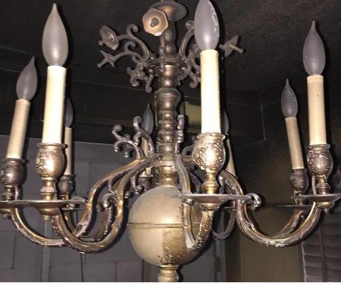 A chandelier that has been damaged by fire 